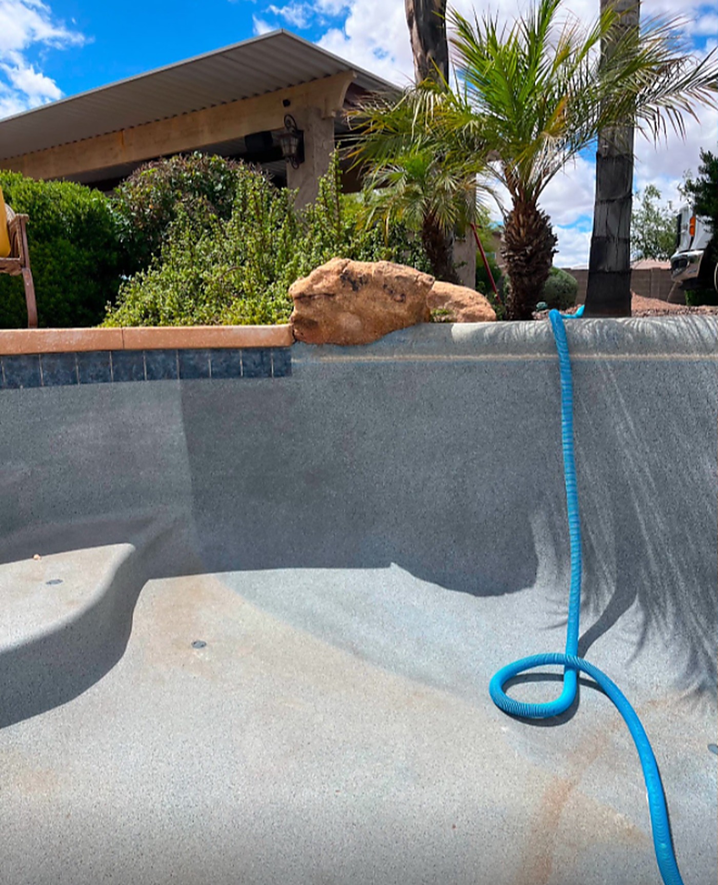 Before: an empty pool shell prepped for resurfacing